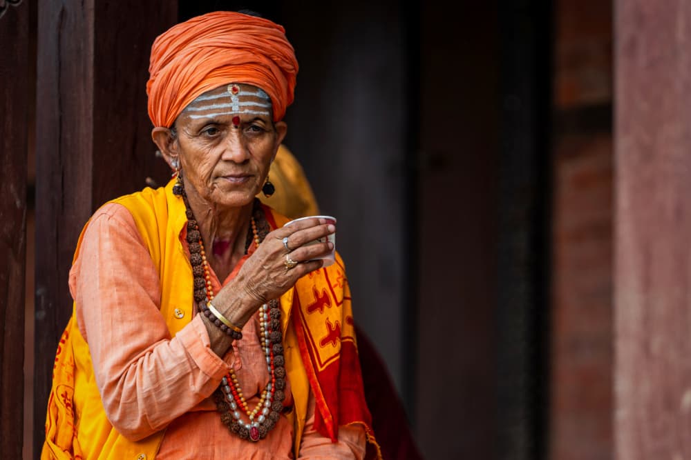 Orange Robe Devotion by HIRAK BHATTACHARJEE — canvas wall art