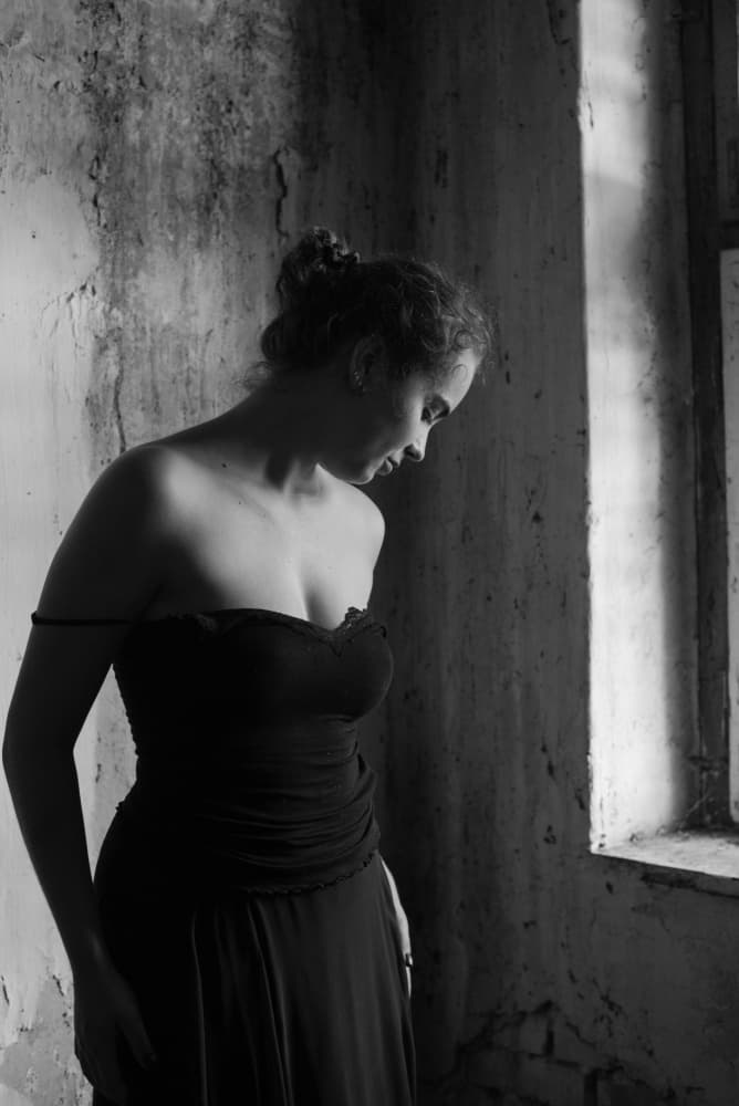 Thoughtful Woman Window Light by Małgorzata Masarz — canvas wall art