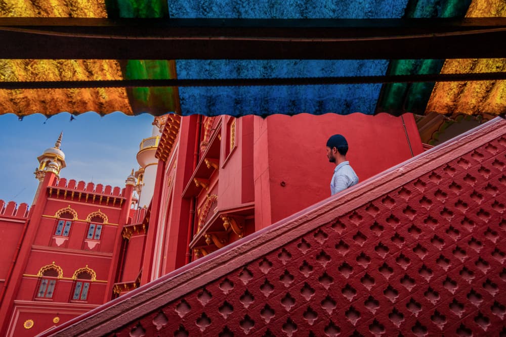 Man on Red Stairs by Kuntal Biswas — canvas wall art