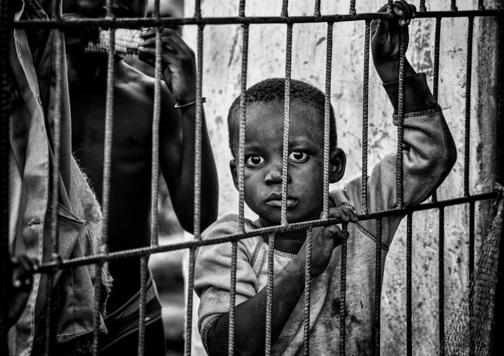 African Boy's Gaze by Joxe Inazio Kuesta Garmendia — canvas wall art