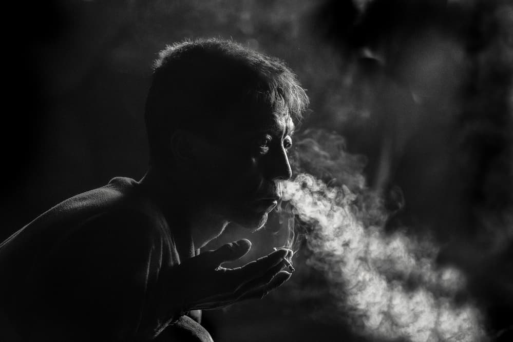 Man Exhaling Smoke by Trevor Cole — canvas wall art