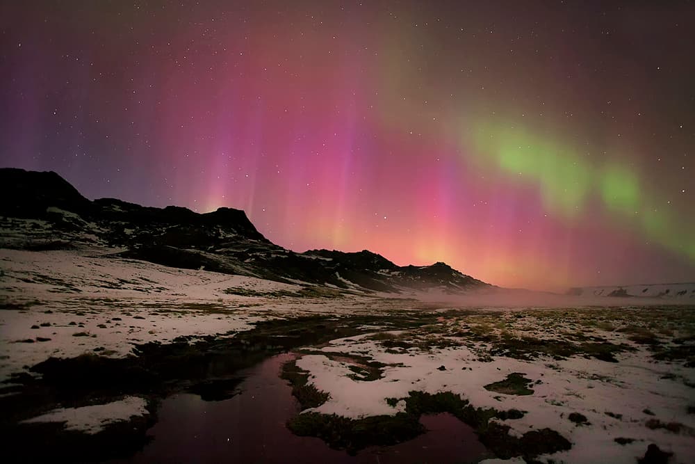 Aurora Over Snowy Mountains by Þorsteinn H. Ingibergsson — canvas wall art