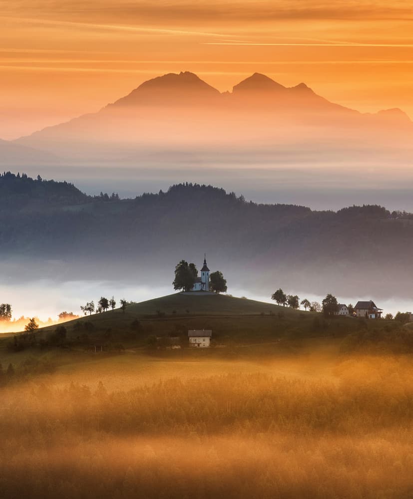 Misty Golden Hour Church by Ales Krivec — canvas wall art