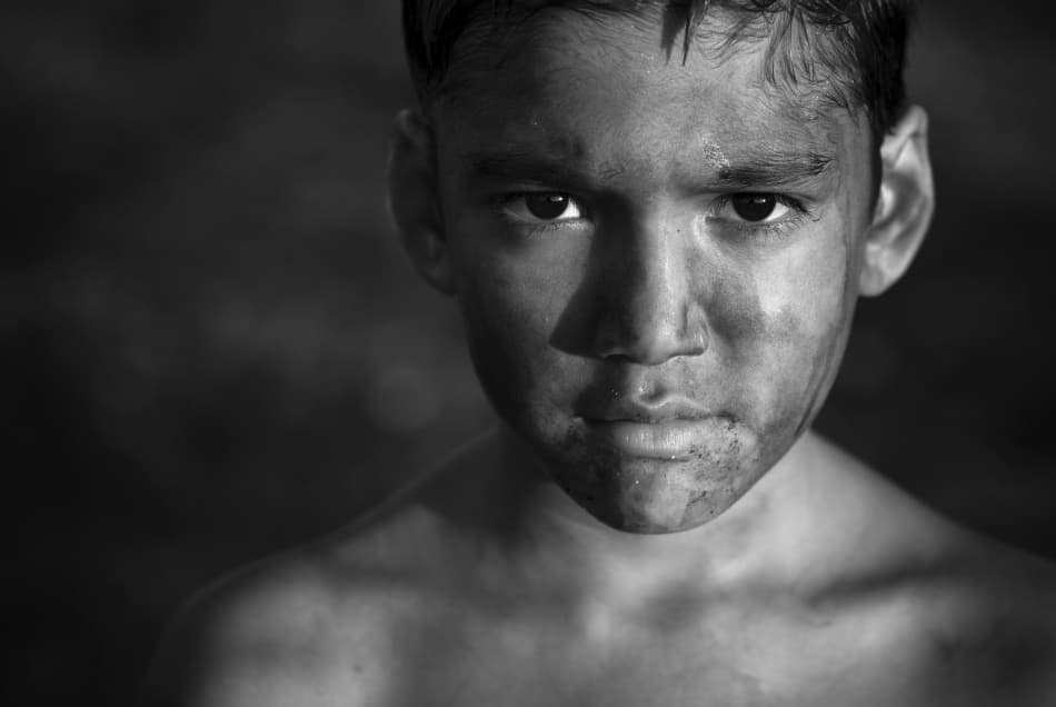 Boy's Resolute Gaze by Miki Meir Levi — canvas wall art