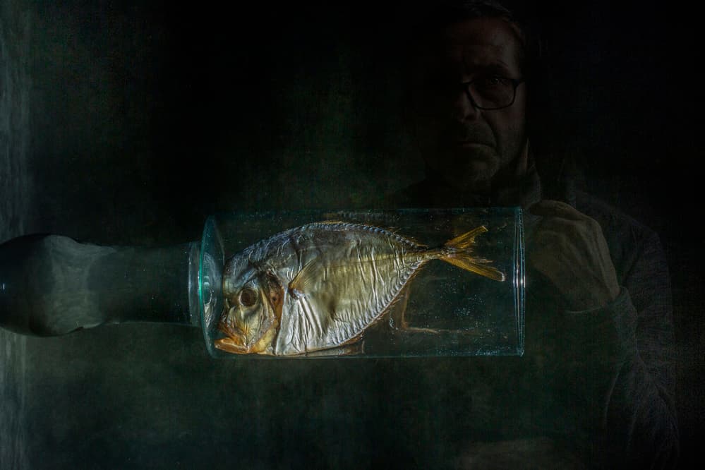 Man and Bottled Fish by Brig Barkow — canvas wall art