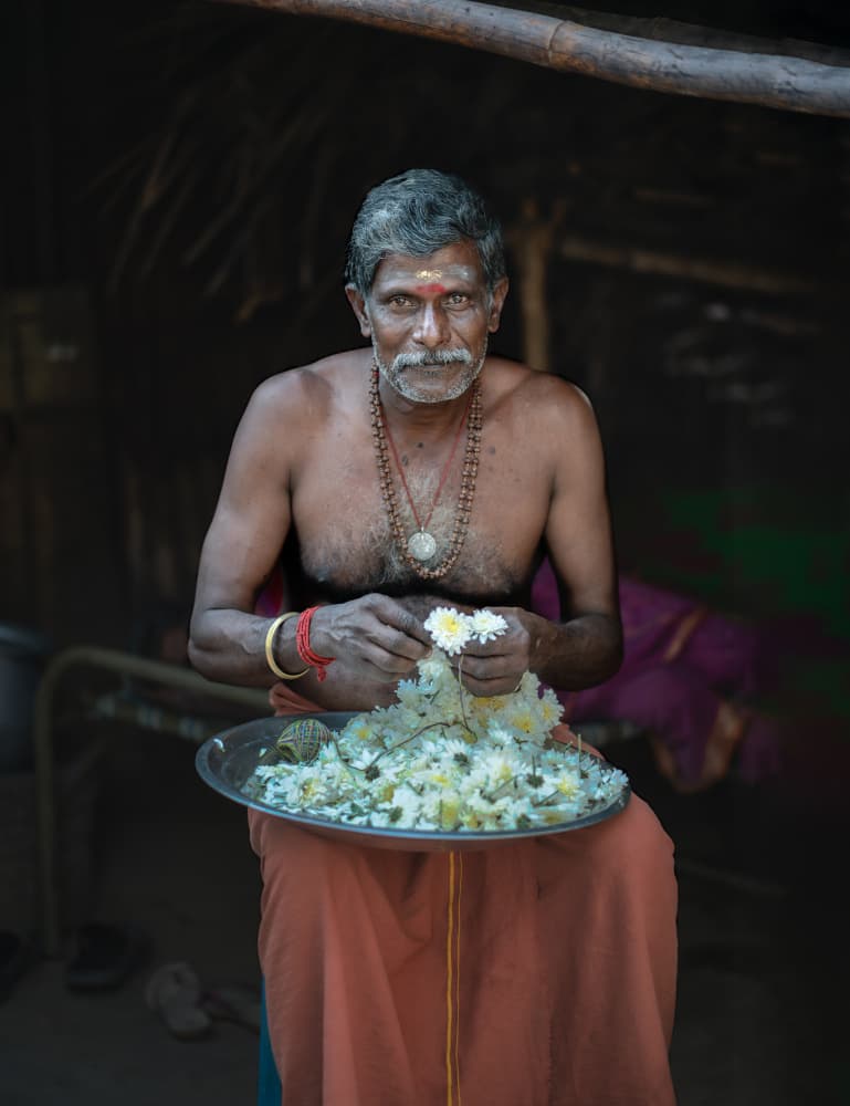 Hindu Man with Flowers by Ludwig Riml — canvas wall art
