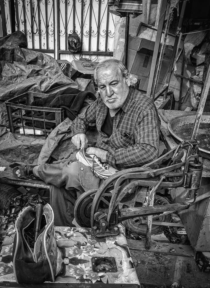 Elderly Cobbler's Workshop by Bashar Alsofey — canvas wall art