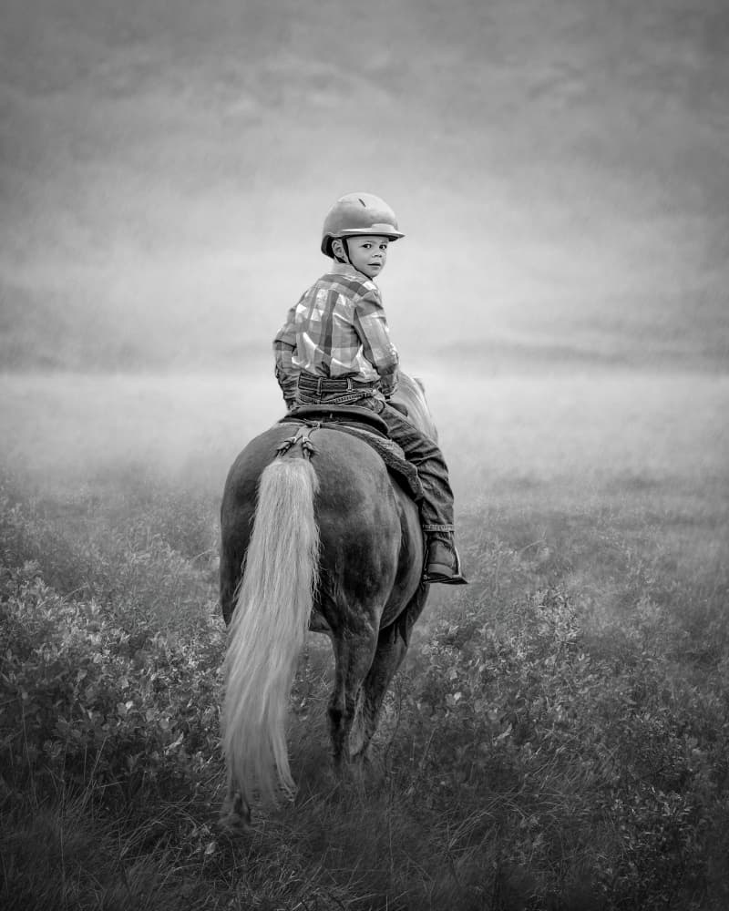 Young Rider Looking Back by Irene Wu — canvas wall art