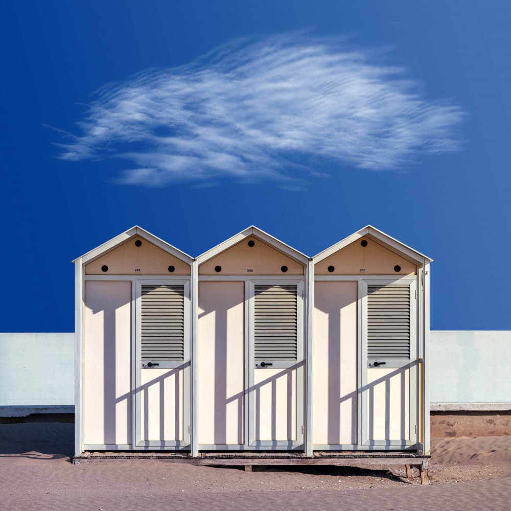 Beach Cabins Blue Sky by Andrea Comari — canvas wall art