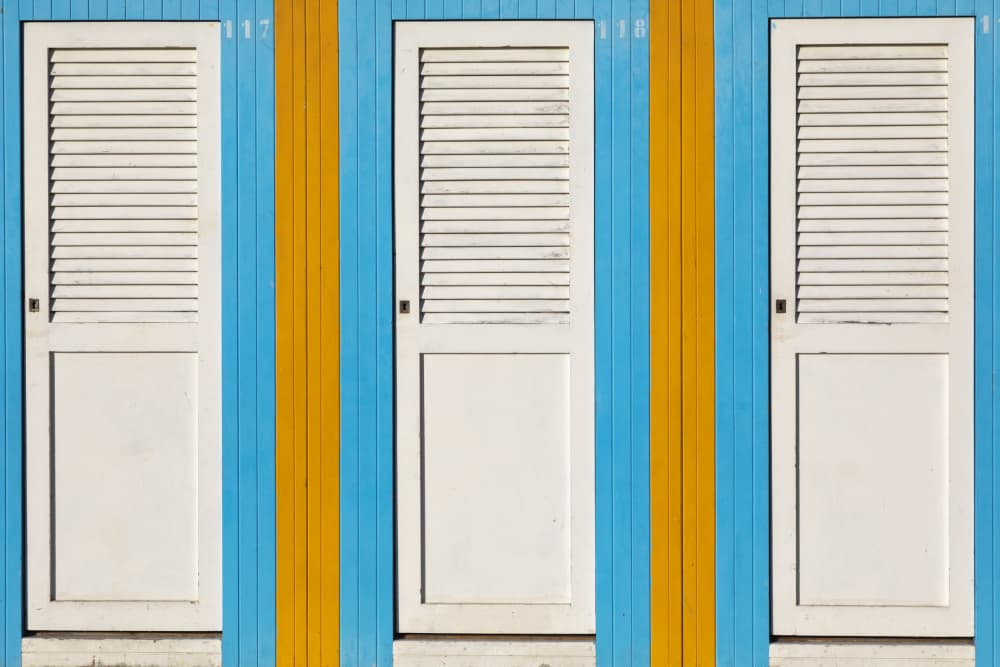 Colorful Beach Hut Doors by Paolo Bolla — canvas wall art