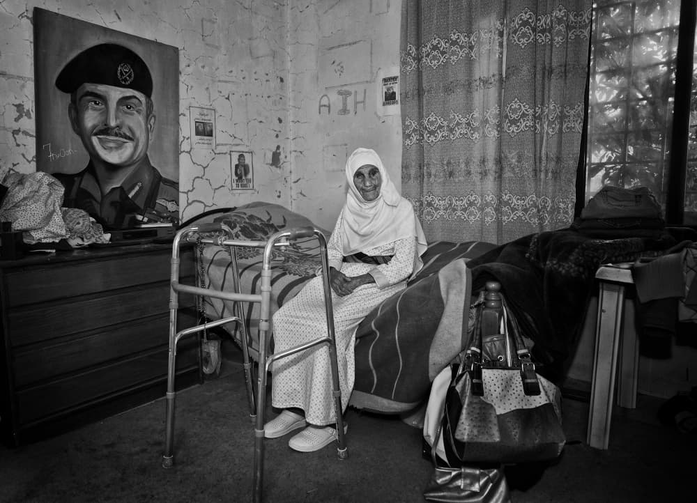 Elderly Woman And Portrait by Rami Al Adwan — canvas wall art
