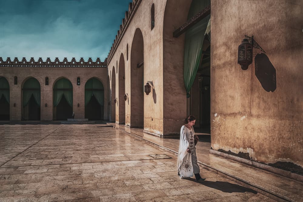 Woman in Ancient Courtyard by Nader El Assy — canvas wall art