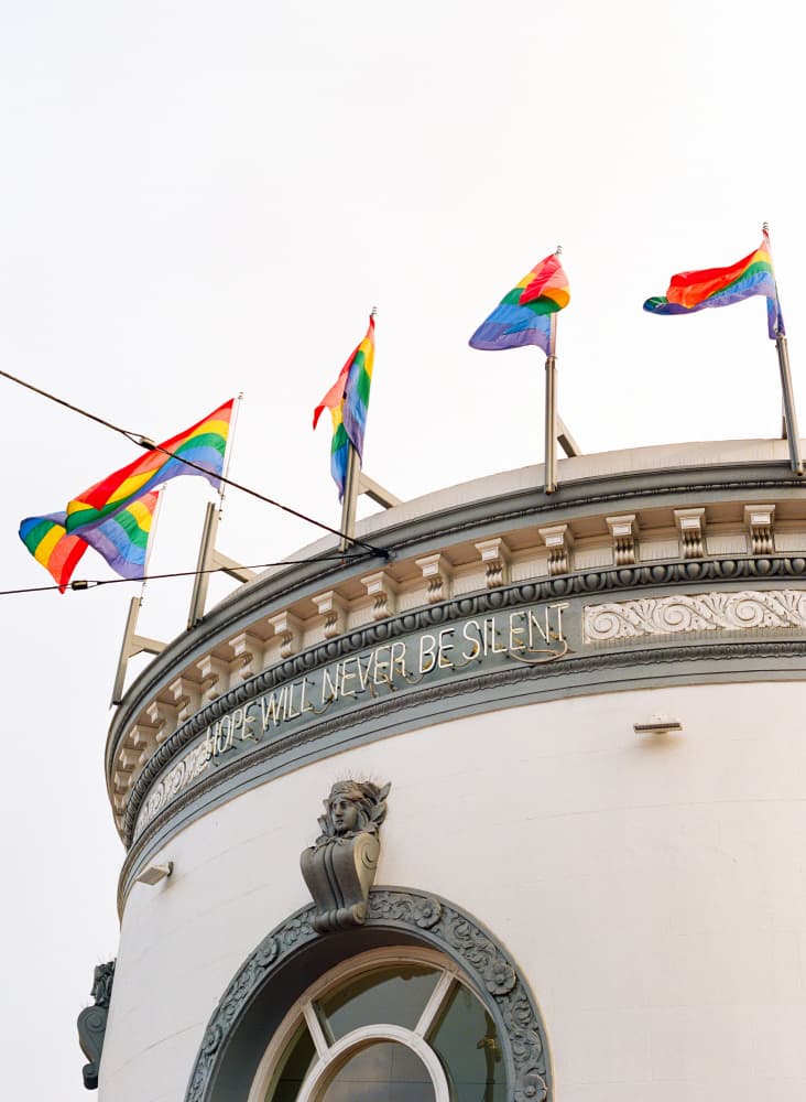 Vibrant Pride Flags Building by Bethany Young — canvas wall art