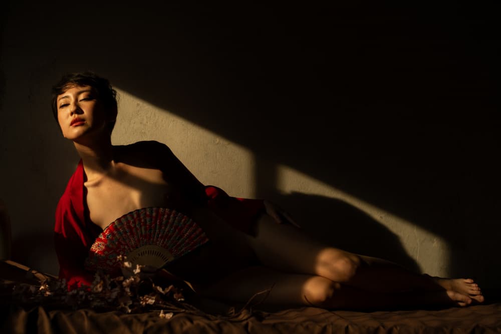 Woman with Red Fan by Thanakorn Chai Telan — canvas wall art