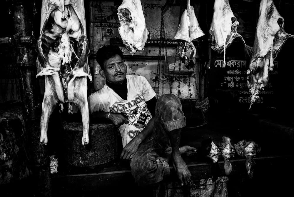 Market Butcher Portrait by Joxe Inazio Kuesta Garmendia — canvas wall art