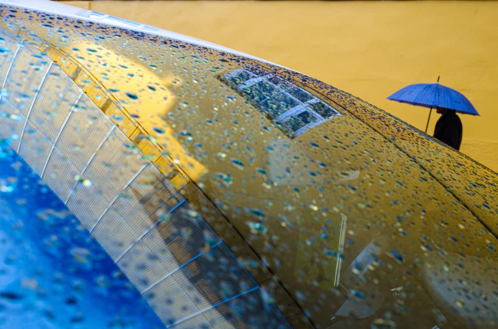 Blue Umbrella Yellow Reflection by Ali Ayer — canvas wall art