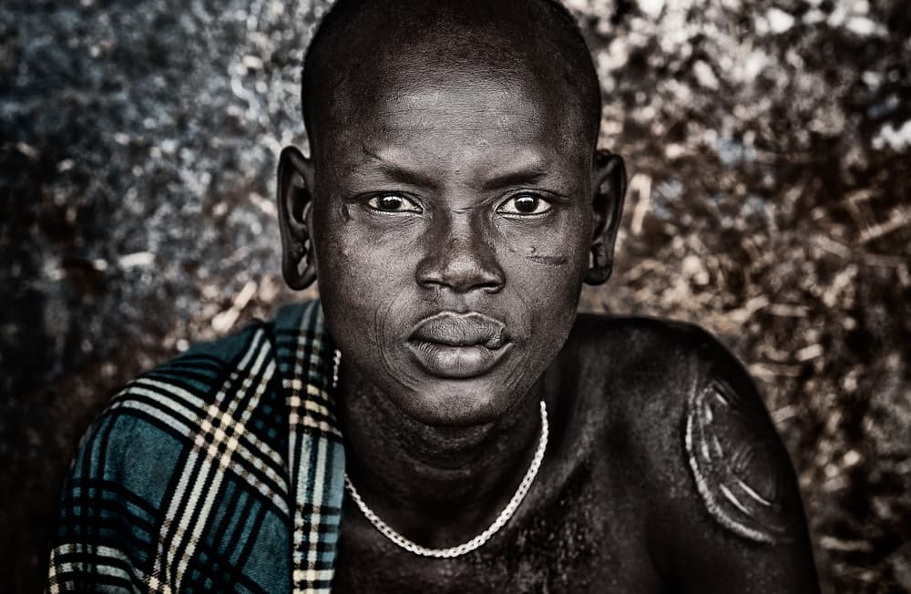 Boy With Tribal Scars by Joxe Inazio Kuesta Garmendia — canvas wall art