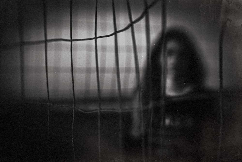 Woman Behind Grid by Bogdan Bouşcă — canvas wall art