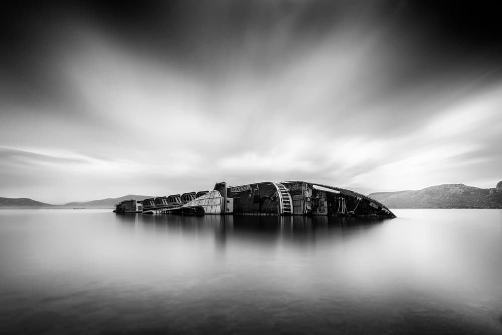Serene Shipwreck Waters by George Digalakis — canvas wall art