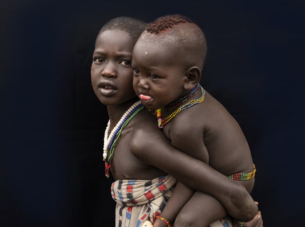 Young African Siblings by Iris Wiener — canvas wall art