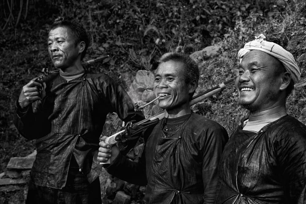 Smiling Traditional Men by BJ Yang — canvas wall art
