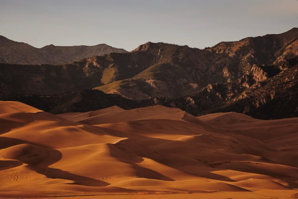 Golden Desert Dunes and Mountains by Del Mundo Imagery — canvas wall art