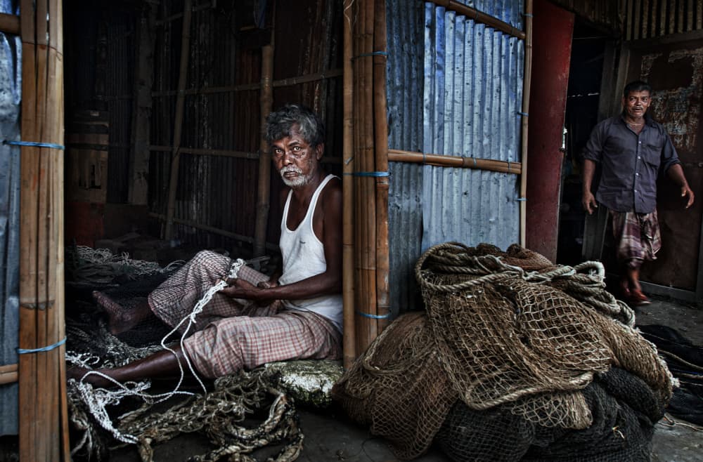 Old Man Mends Nets by Joxe Inazio Kuesta Garmendia — canvas wall art