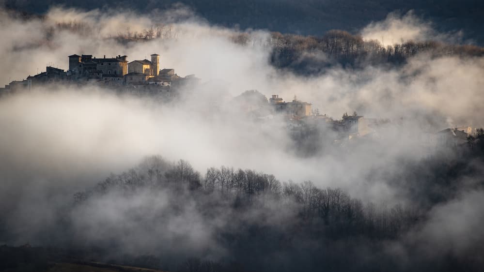 Misty Mountain Village by Riccardo Lucidi — canvas wall art