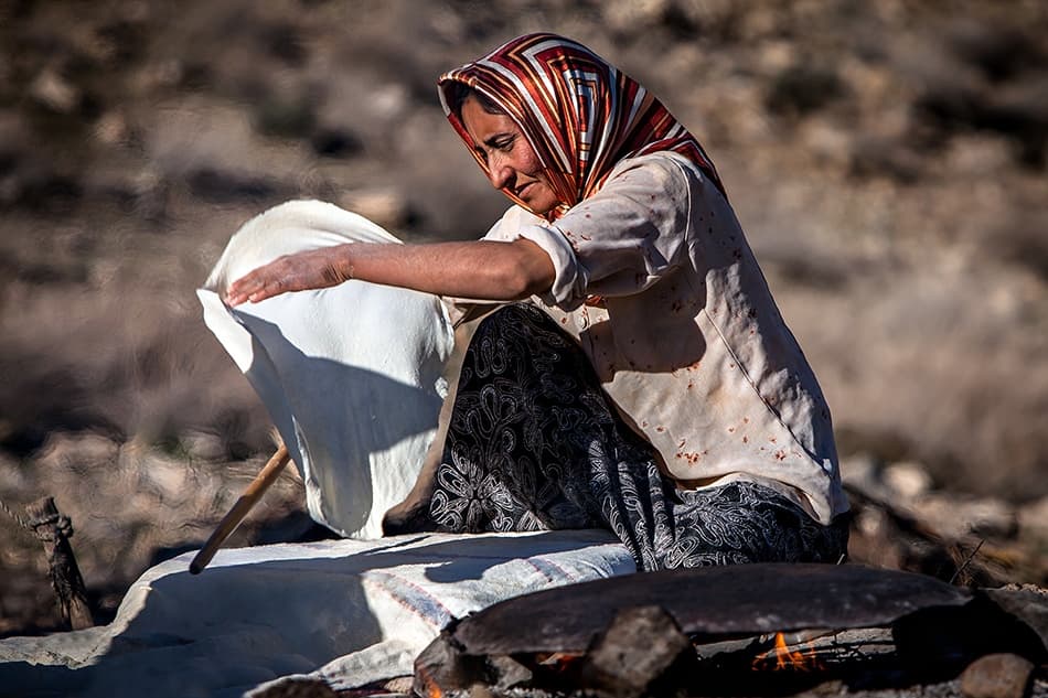 Woman Baking Flatbread by Mohammadreza Momeni — canvas wall art