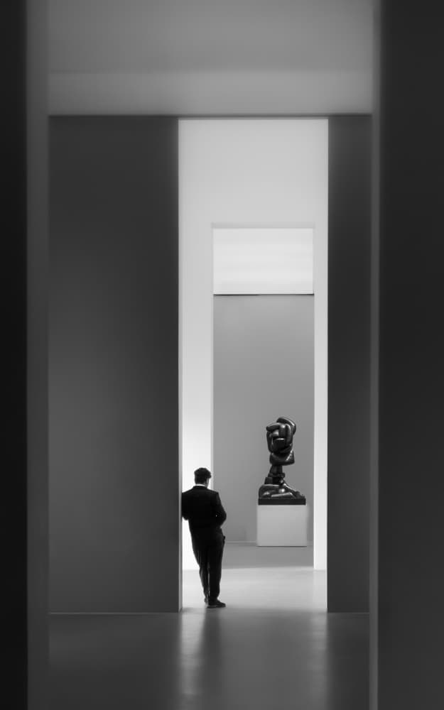 Man and Museum Sculpture by Andy Dauer — canvas wall art
