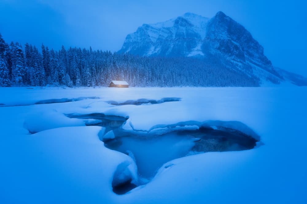 Cozy Winter Lake Cabin by Yongnan Li (李永男) — canvas wall art