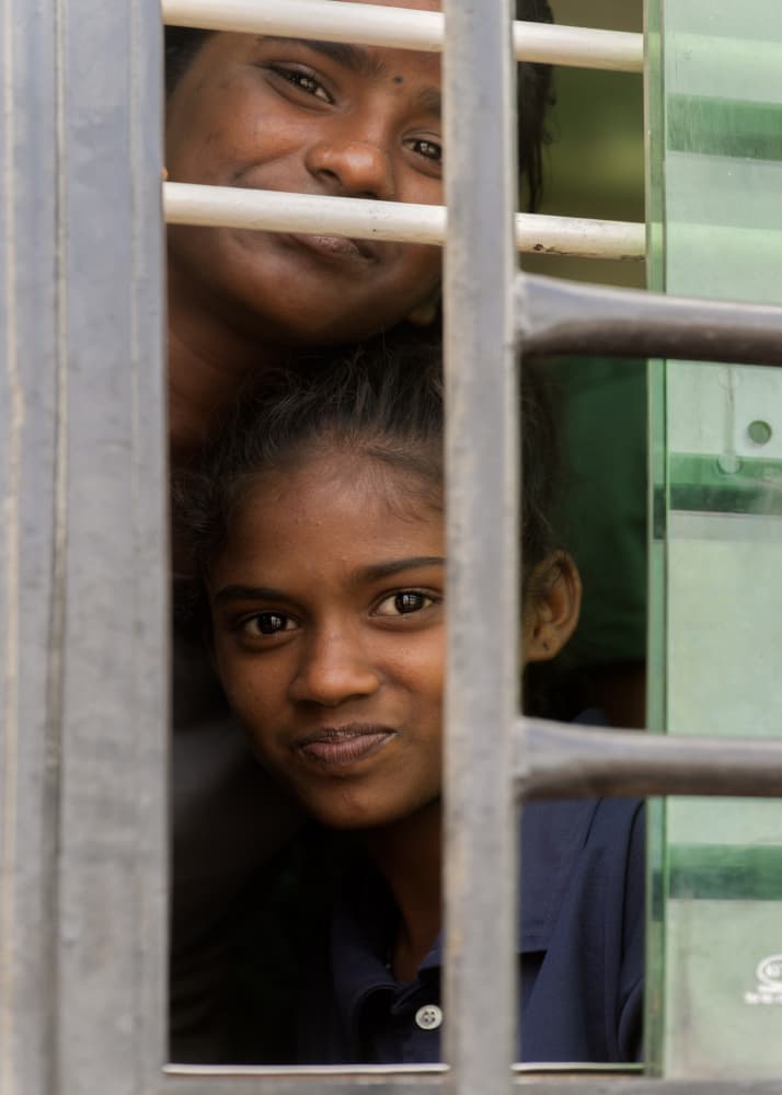 Smiling Faces In Window by Ludwig Riml — canvas wall art