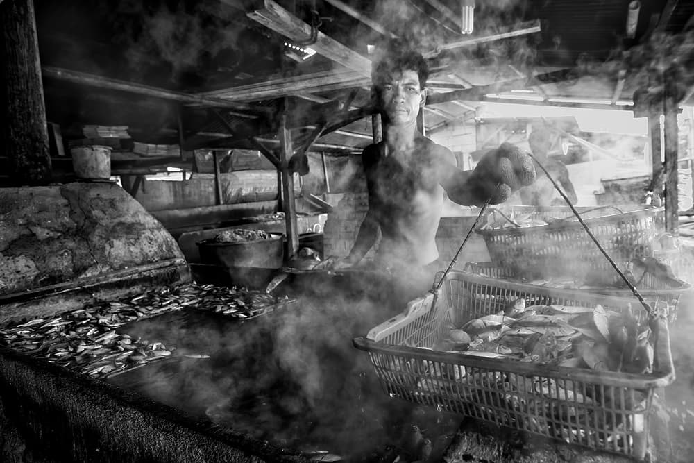 Smoky Fish Processing by Gunarto Song — canvas wall art