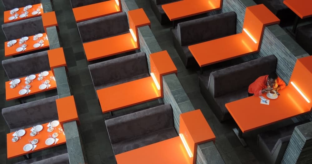 Vibrant Orange Cafe Seating by Huib Limberg — canvas wall art