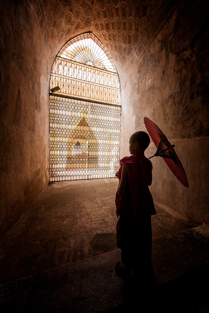 Monk With Red Umbrella by Gunarto Song — canvas wall art