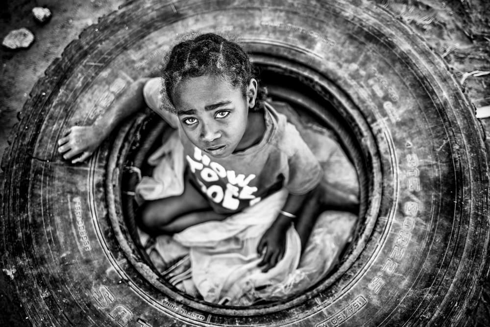 Child In The Tire by Marco Tagliarino — canvas wall art