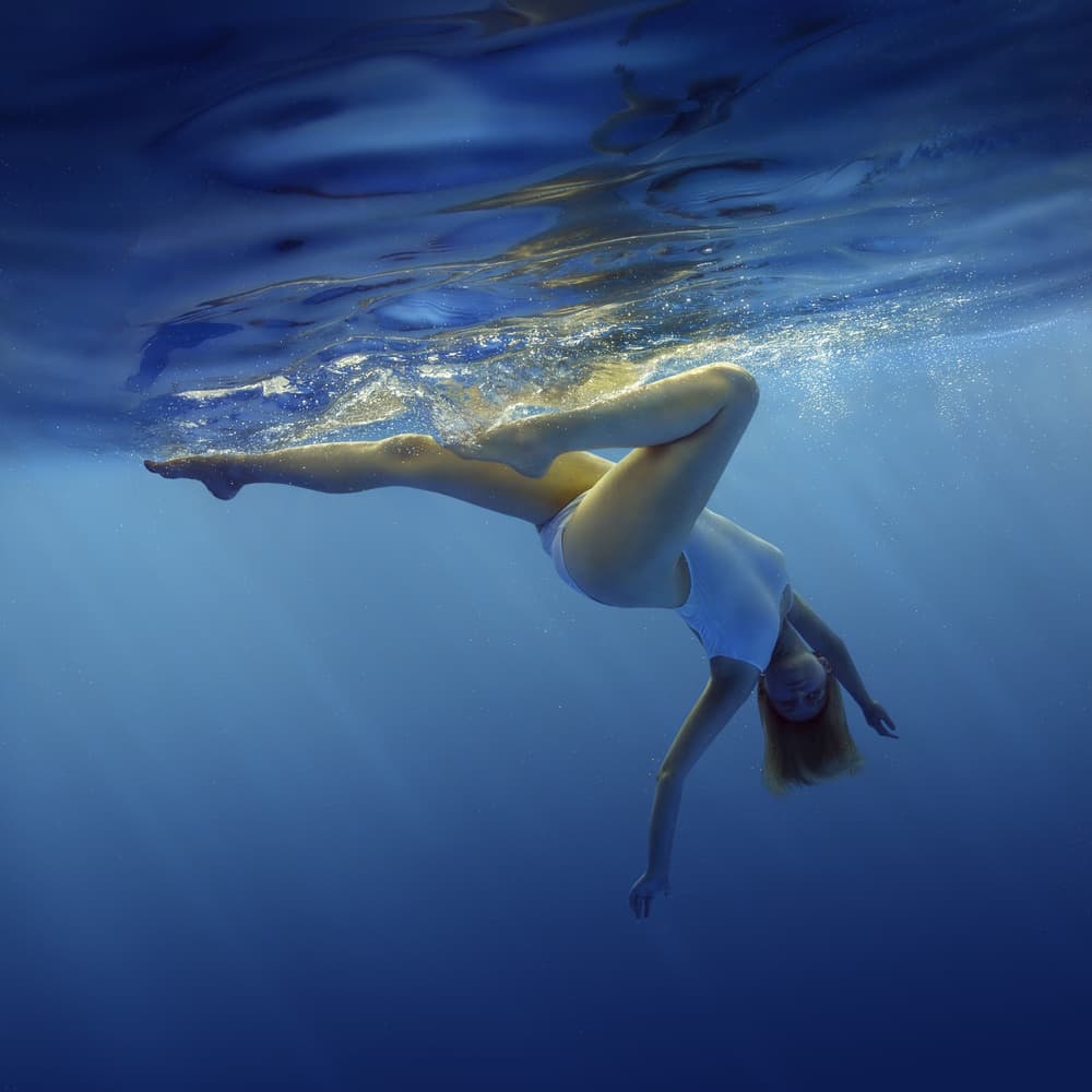 Graceful Underwater Float by Dmitry Frizel — canvas wall art