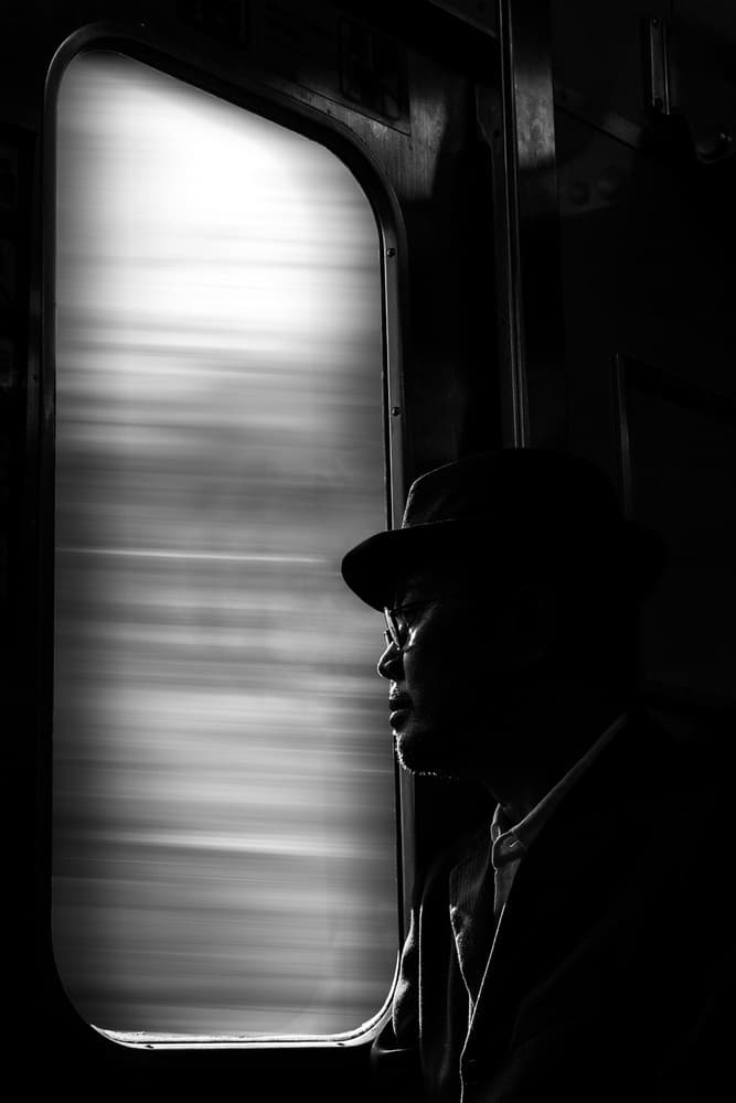 Silhouetted Man On Train by Antonyus Bunjamin (Abe) — canvas wall art