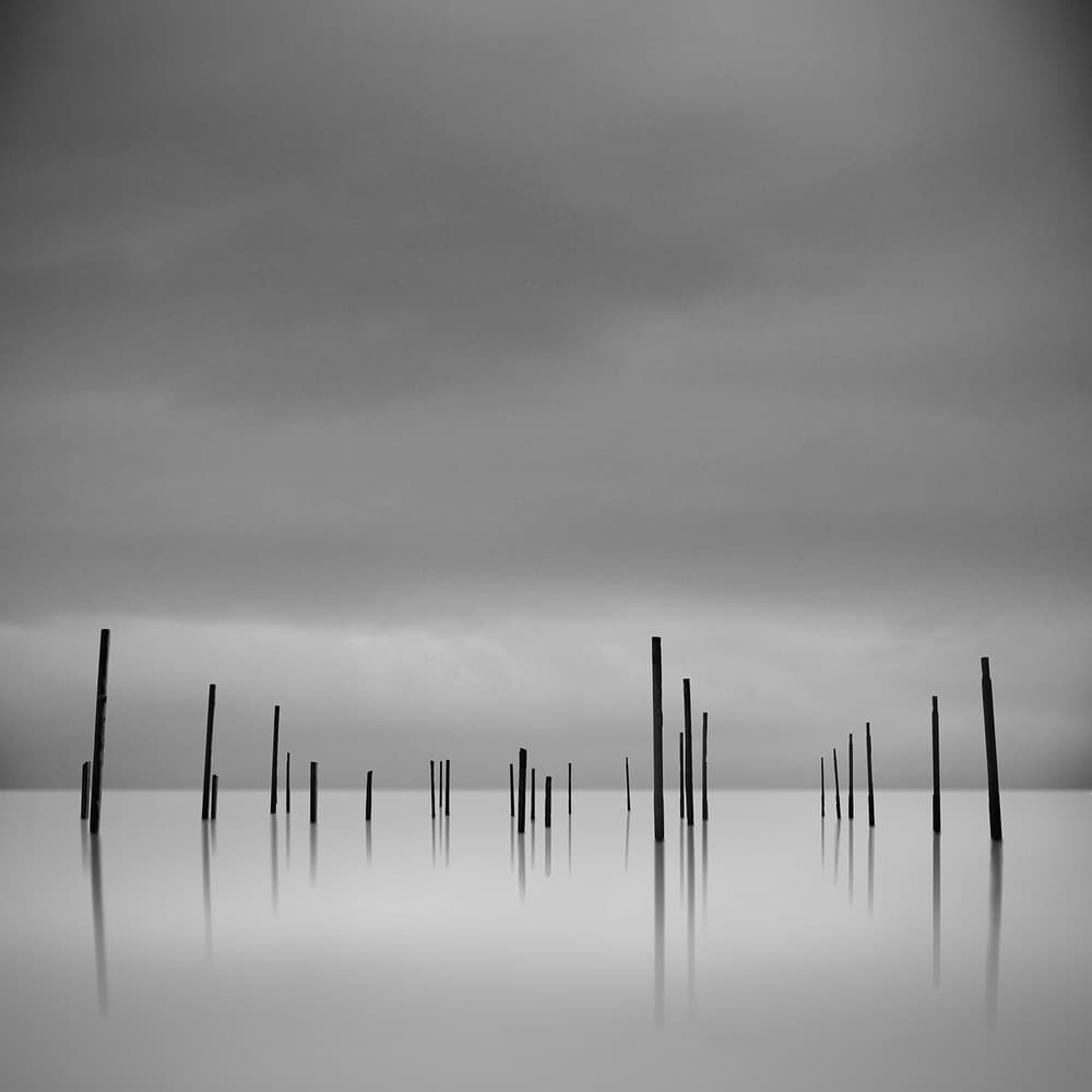 Poles In Still Water by George Digalakis — canvas wall art