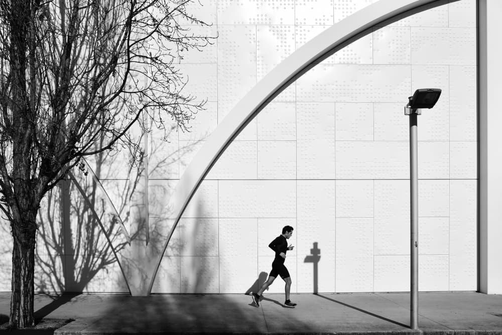 Urban Runner's Shadow by Jorge Pimenta — canvas wall art