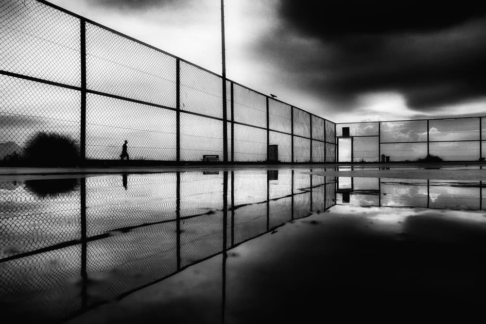 Lone Figure Reflection by Ali Ayer — canvas wall art