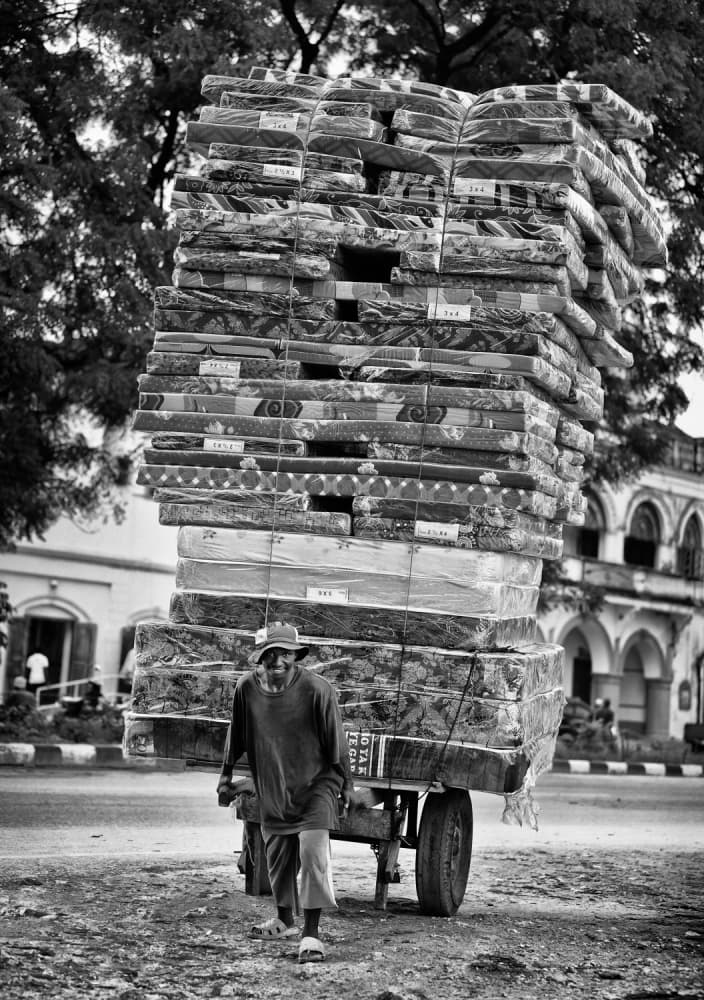 Man and Mattress Cart by Goran Jovic — canvas wall art