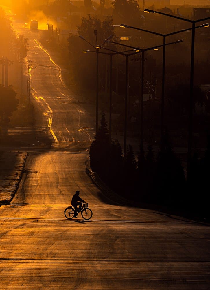 Golden Hour Cyclist by Emir Bagci — canvas wall art