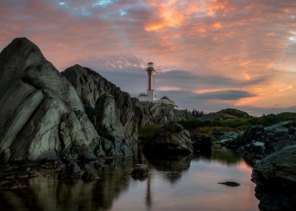 Lighthouse Sunset Reflection by Ambar Saha — canvas wall art