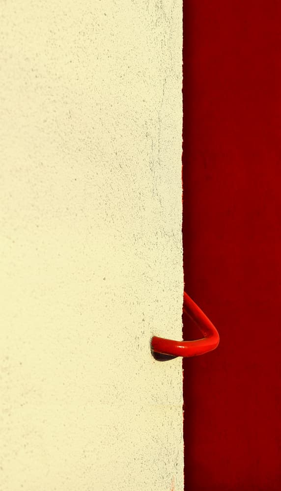 Bold Red Handle and Wall by Anna Niemiec — canvas wall art