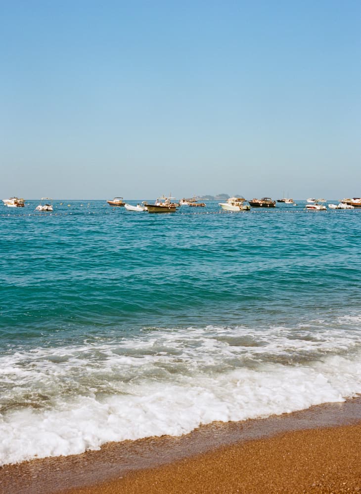 Beach Waves and Boats by Bethany Young — canvas wall art