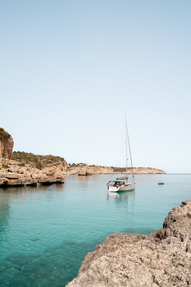 Sailboat in Turquoise Bay by Henrike Schenk — canvas wall art