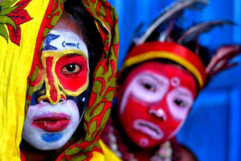 Vibrant Painted Faces by Avishek Das — canvas wall art