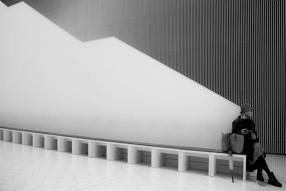 Pensive Woman Architectural Space by Anna Niemiec — canvas wall art