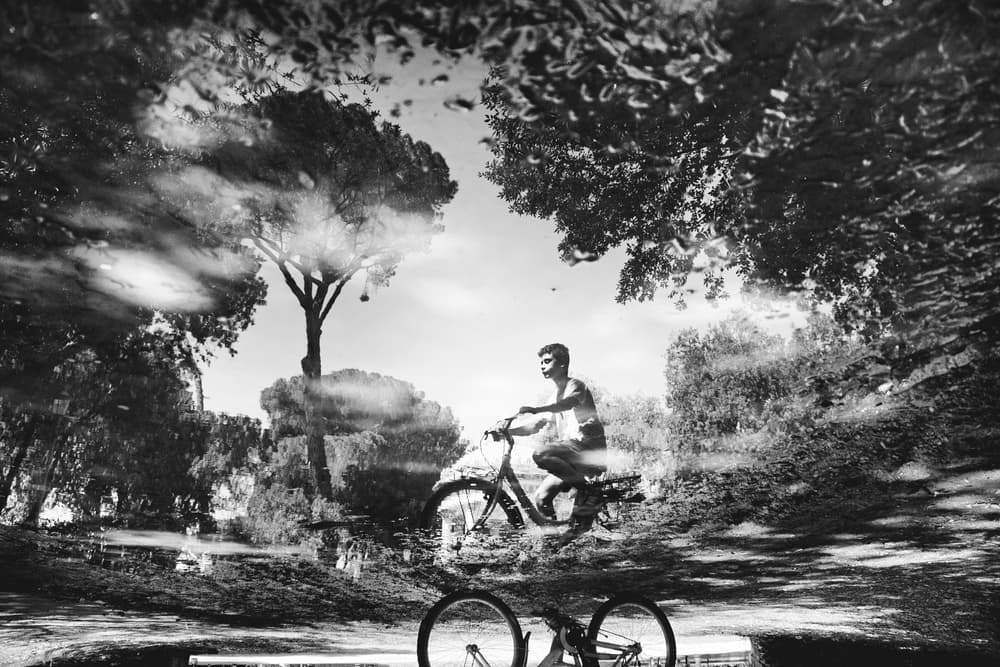 Reflected Cycling Journey by Antonio Grambone — canvas wall art